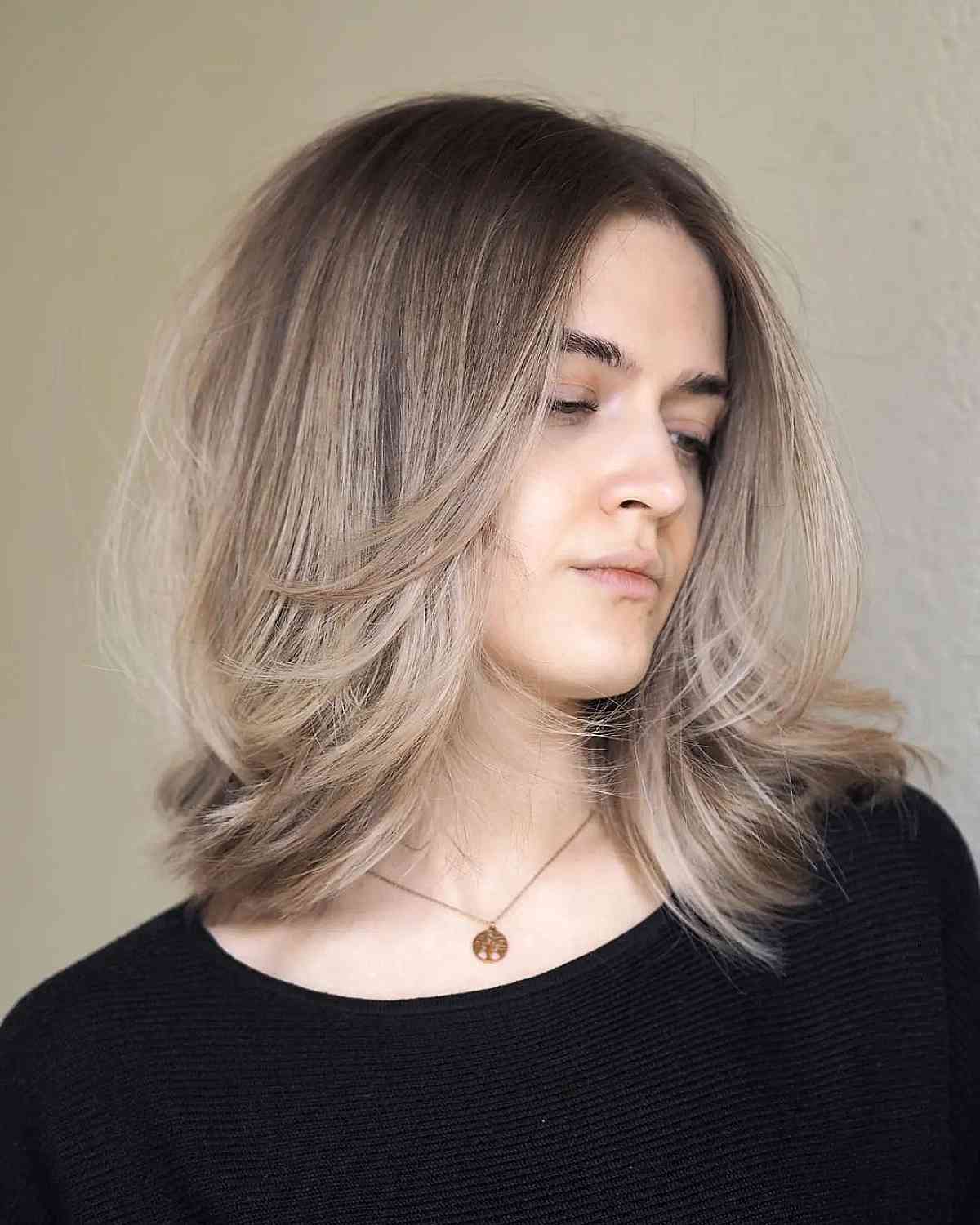 Mid-Length Middle Part Hairstyle Featuring Front Layers