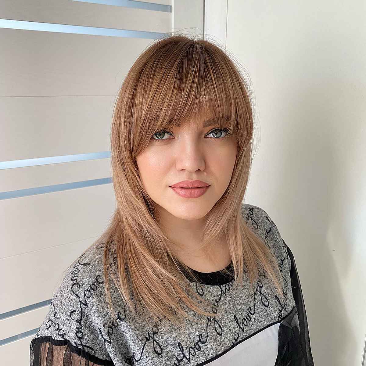 modern face-framing layers with bangs