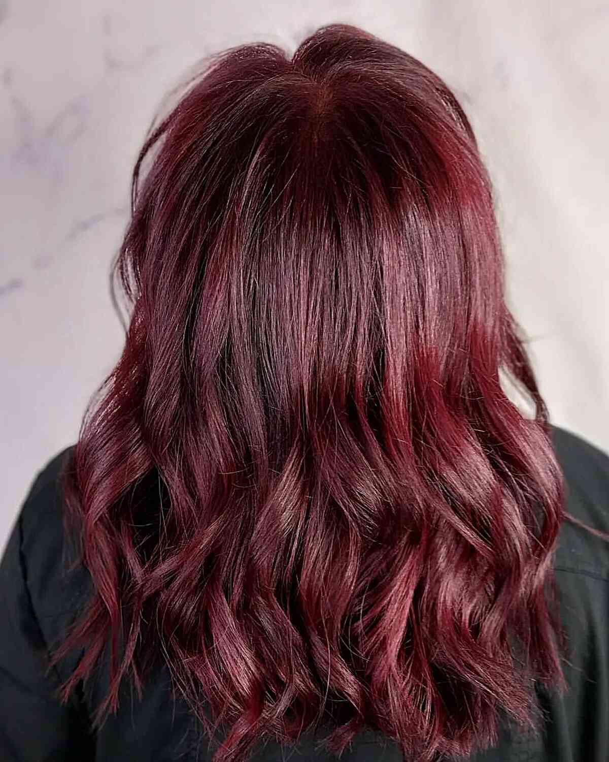 Mulled Wine Burgundy Hair Shade with Medium-Length Layered Cut