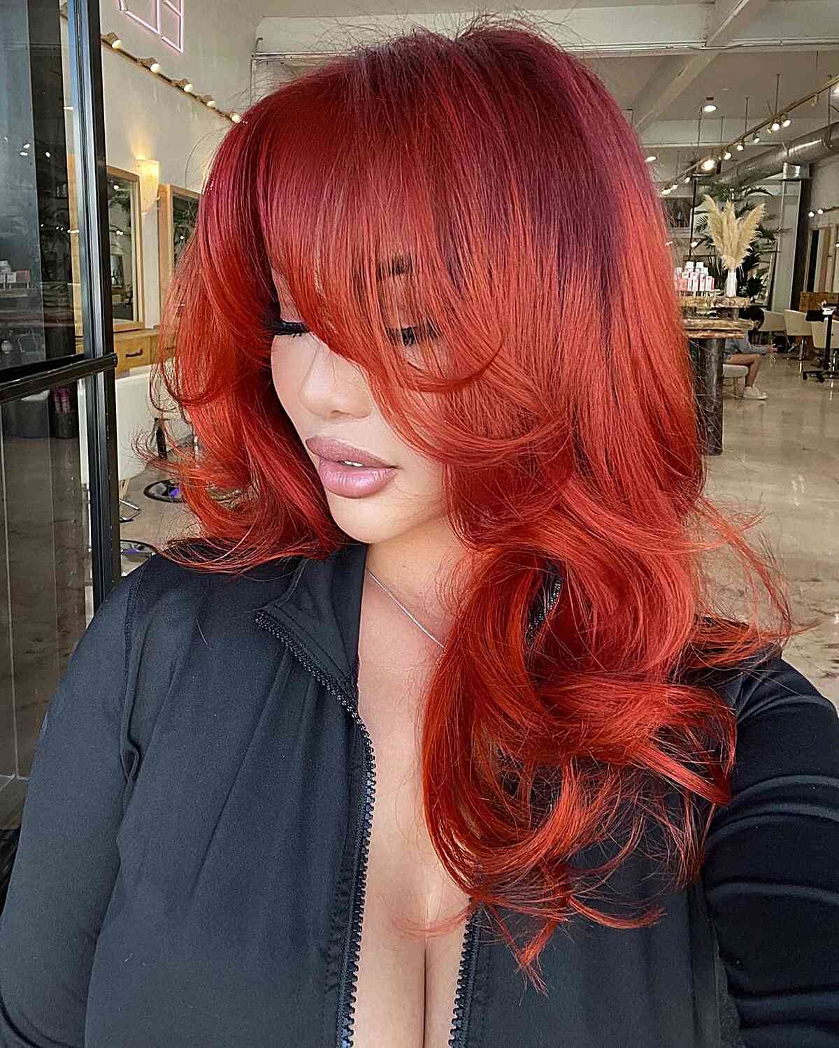 Medium-Length Pamela Anderson-Style Blowout with Face-Framing Layers