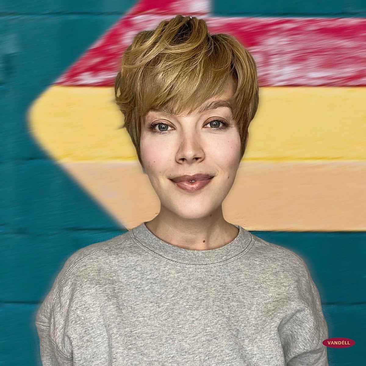 Pixie Haircut Featuring Brow-Length Bangs and Crown Layers