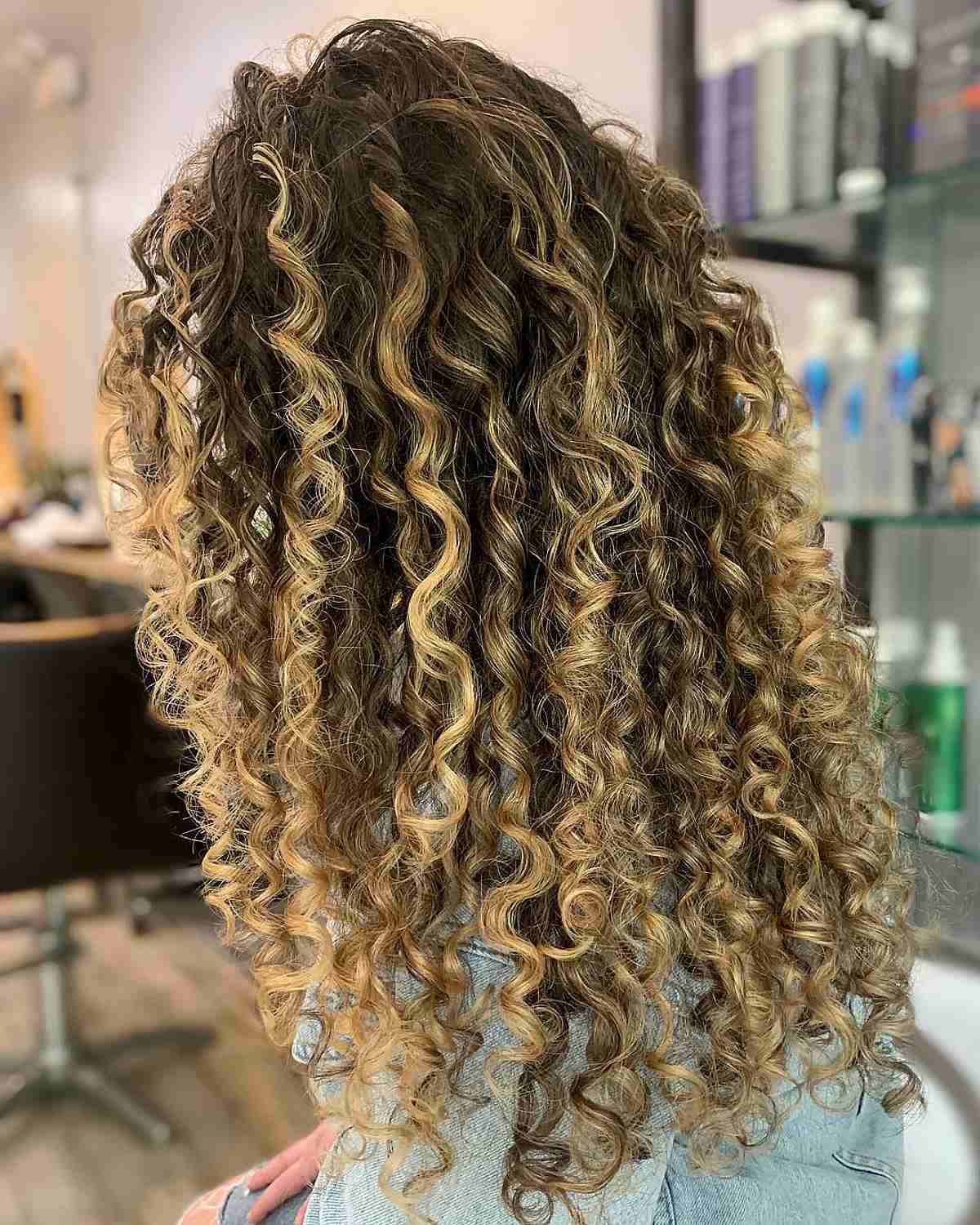 Radiant Blonde Balayage Curls on Deep Brown Hair