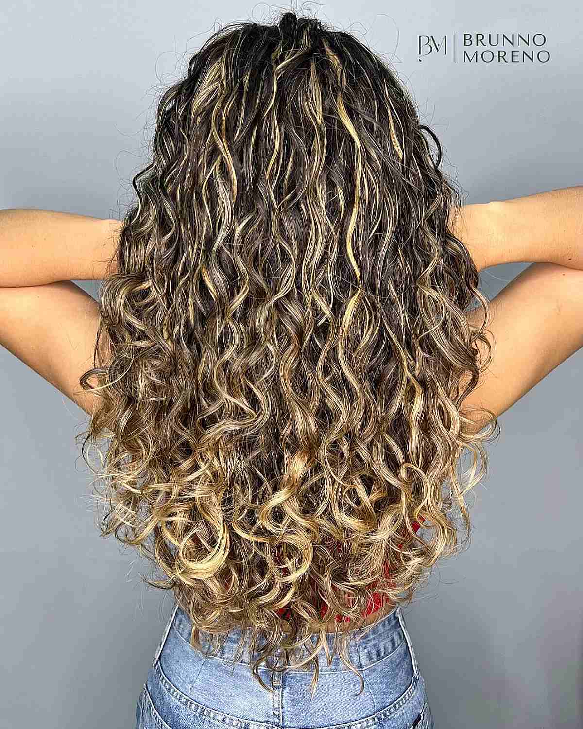 Radiant Blonde Balayage Highlights on Long Dark Brown Curls