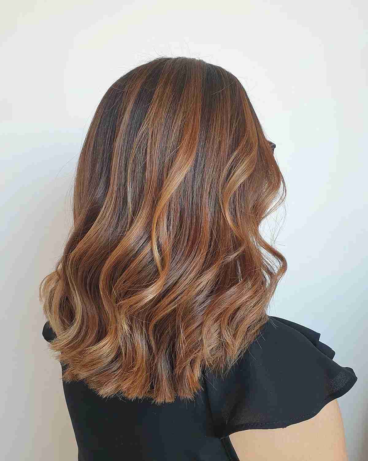 Balayage Radiant Caramel and Golden Highlights on Dark Brown Hair