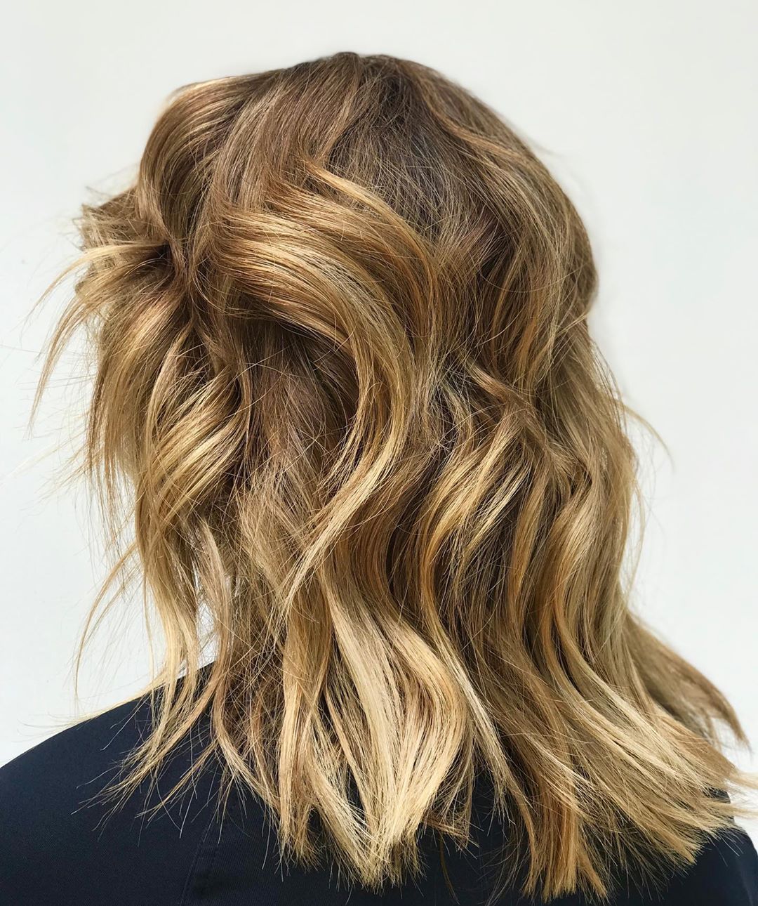 Radiant Golden Blonde Highlights for Medium Length Hair