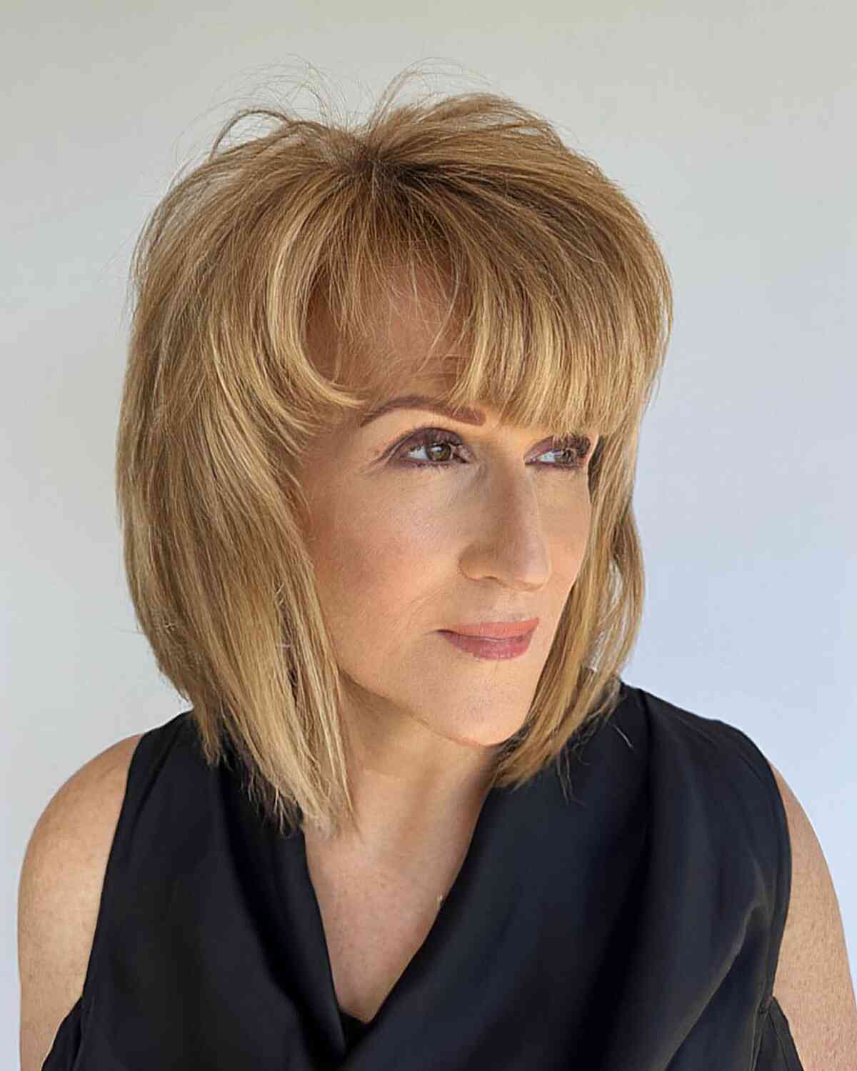 Radiant Golden Blonde Layered Cut for Women in Their 40s with thicker hair