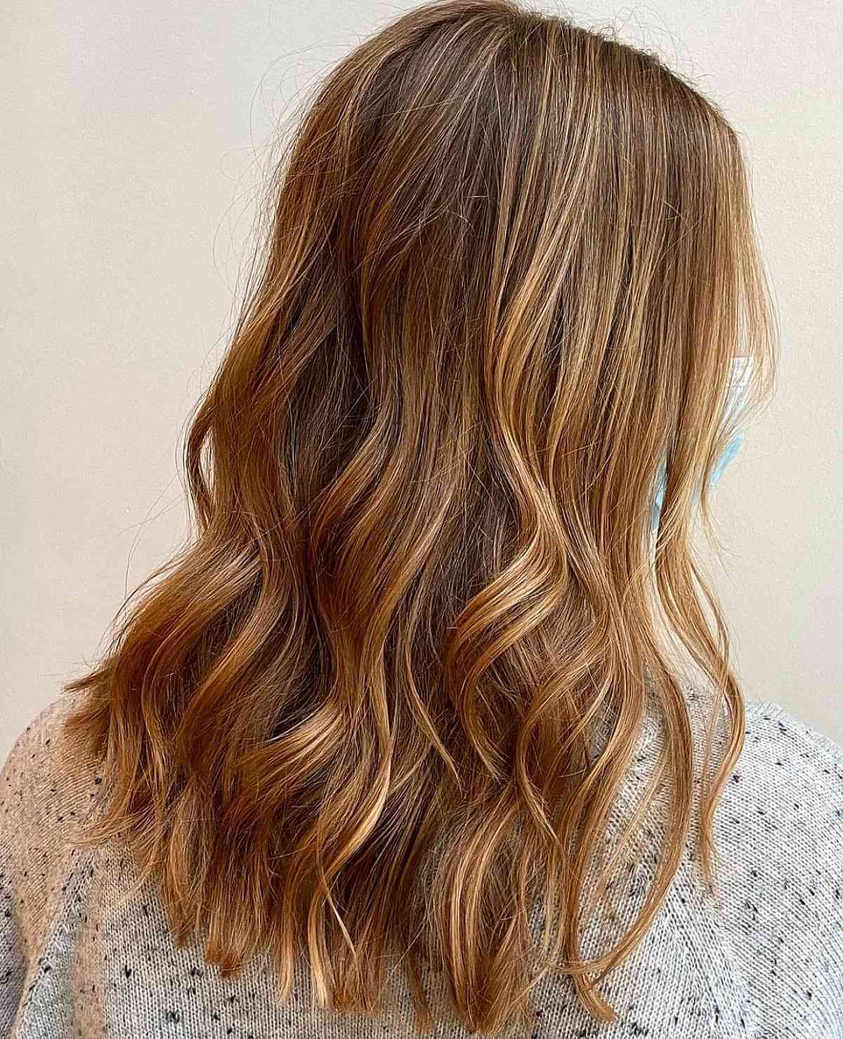 Radiant Strawberry Highlights on Brunette Hair
