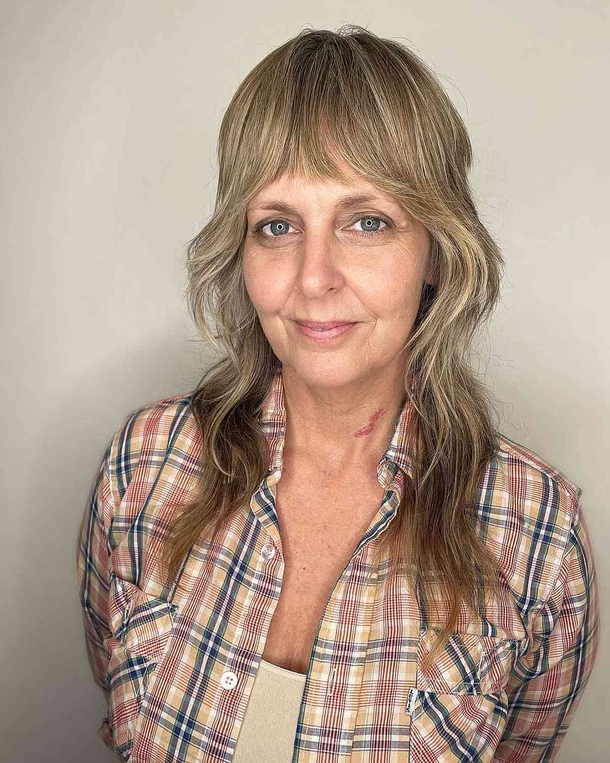 Medium Razor Cut Shag with Bangs for Women Over Fifty