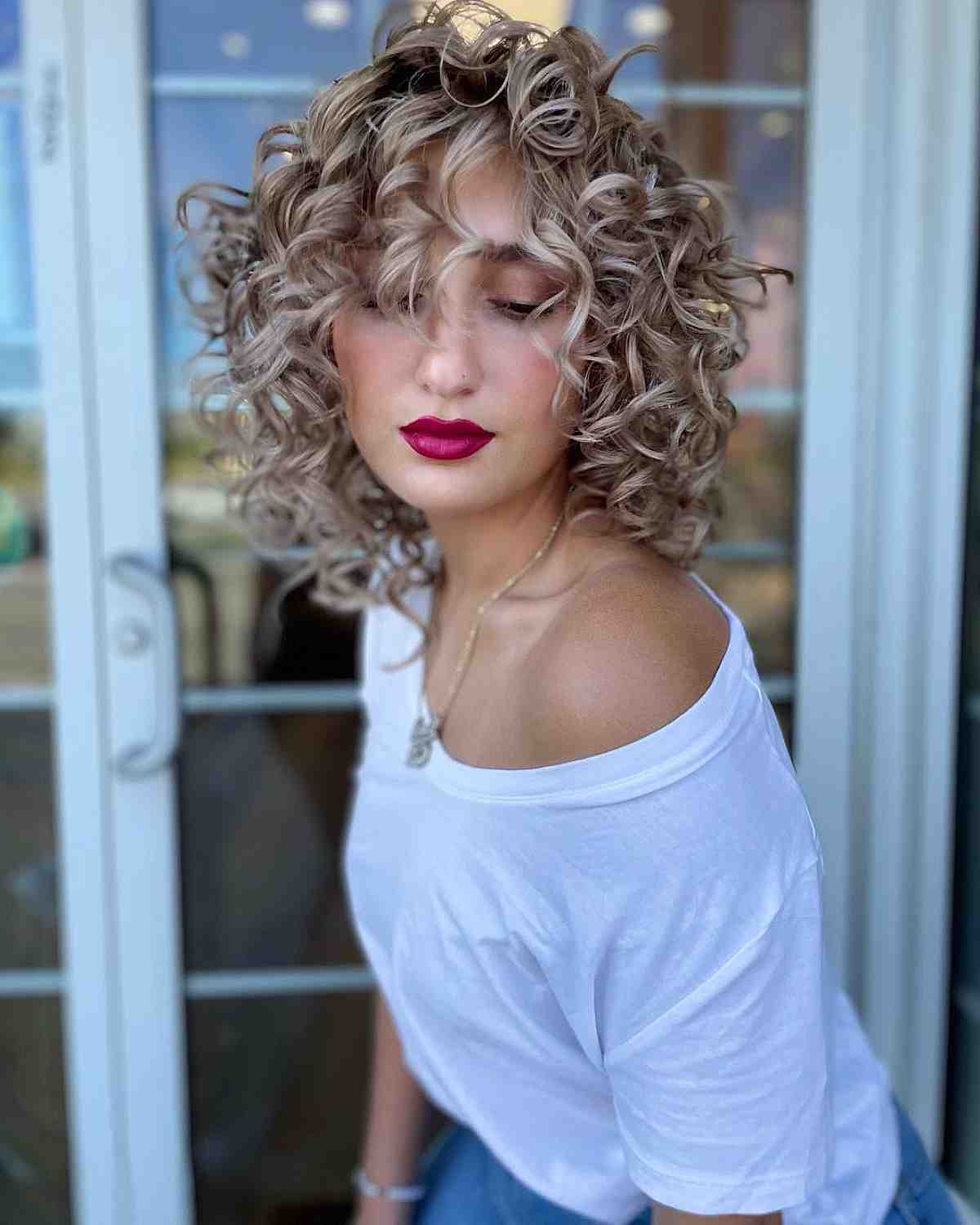 Retro-Inspired Natural Curls with Bangs