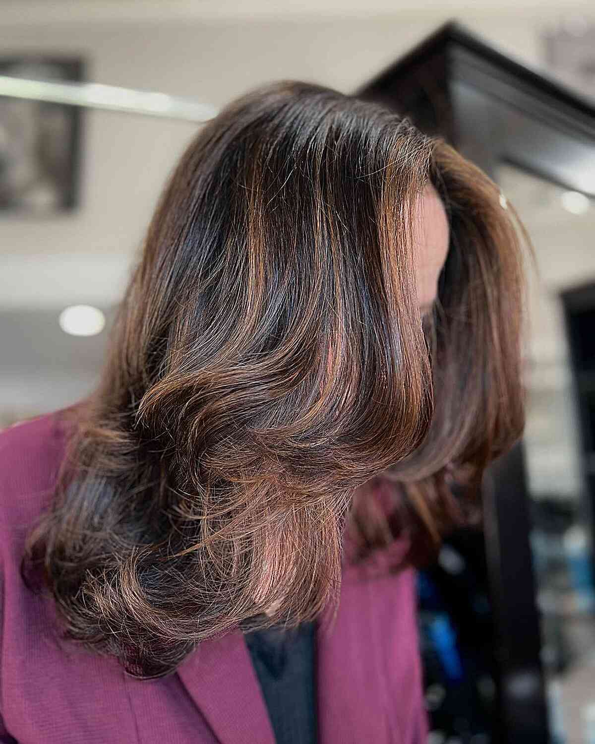 Rich Caramel Highlights with Flattering Face-Framing Layers for Dark Brown and Medium-Length Hair