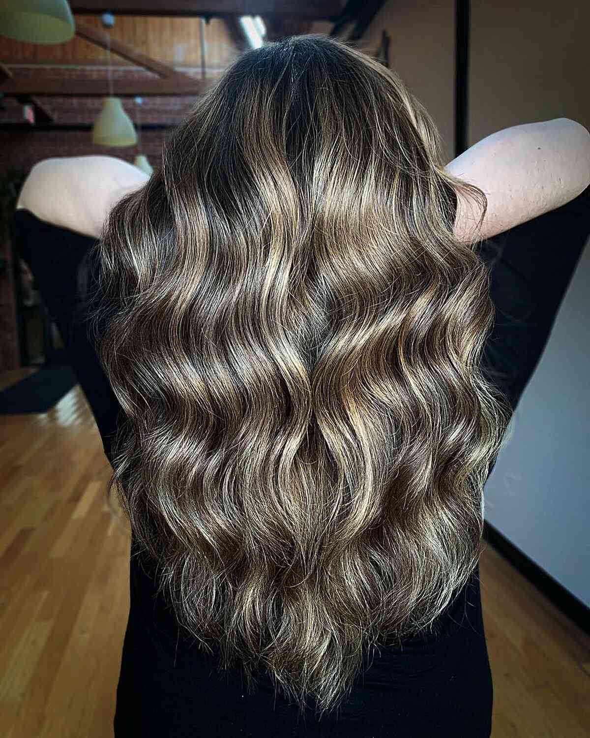 Rich Honey Blonde Balayage on Dark Hair with Long Waves