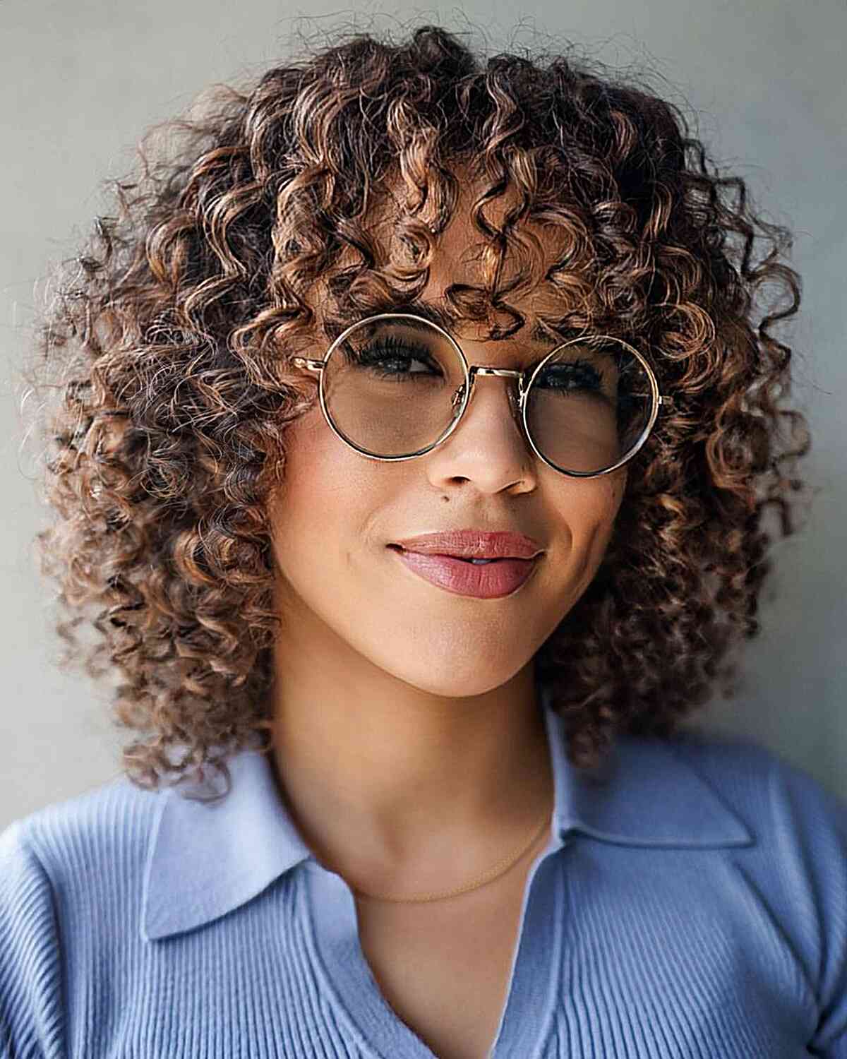 Rose-Toned Beige Curls with Bangs for women with thick curly hair