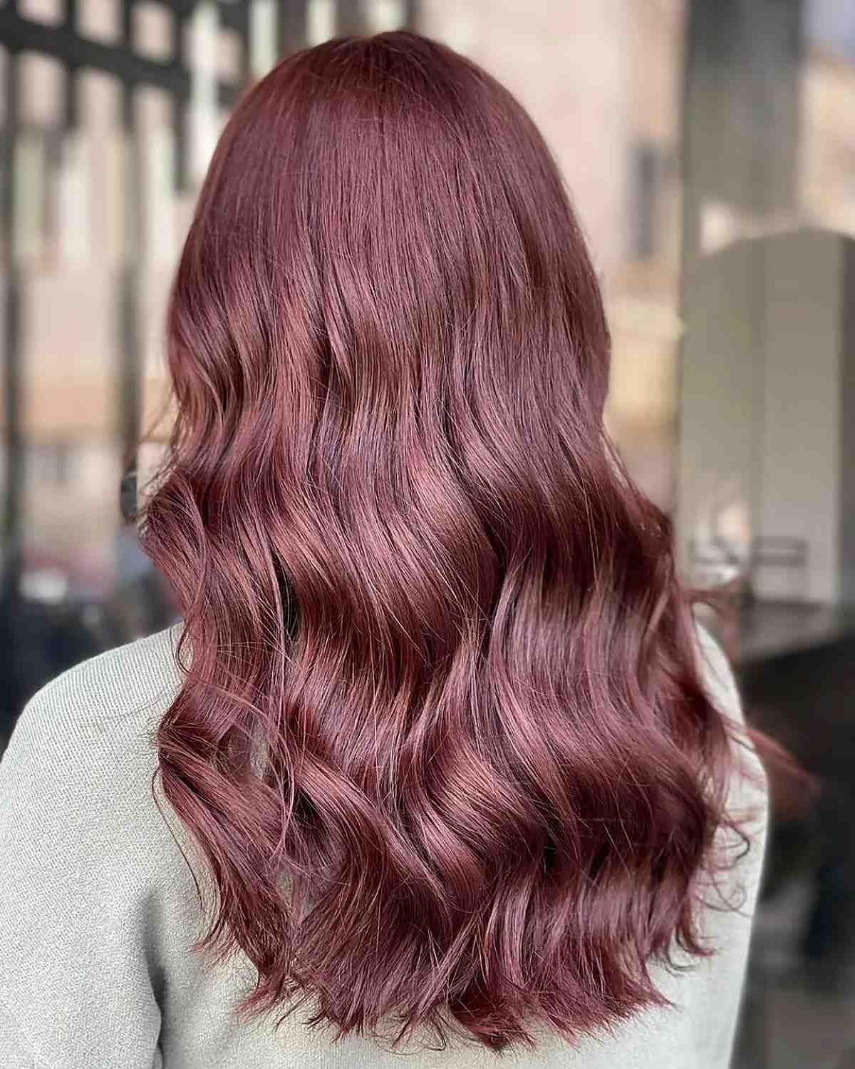 sangria burgundy on luscious wavy hair