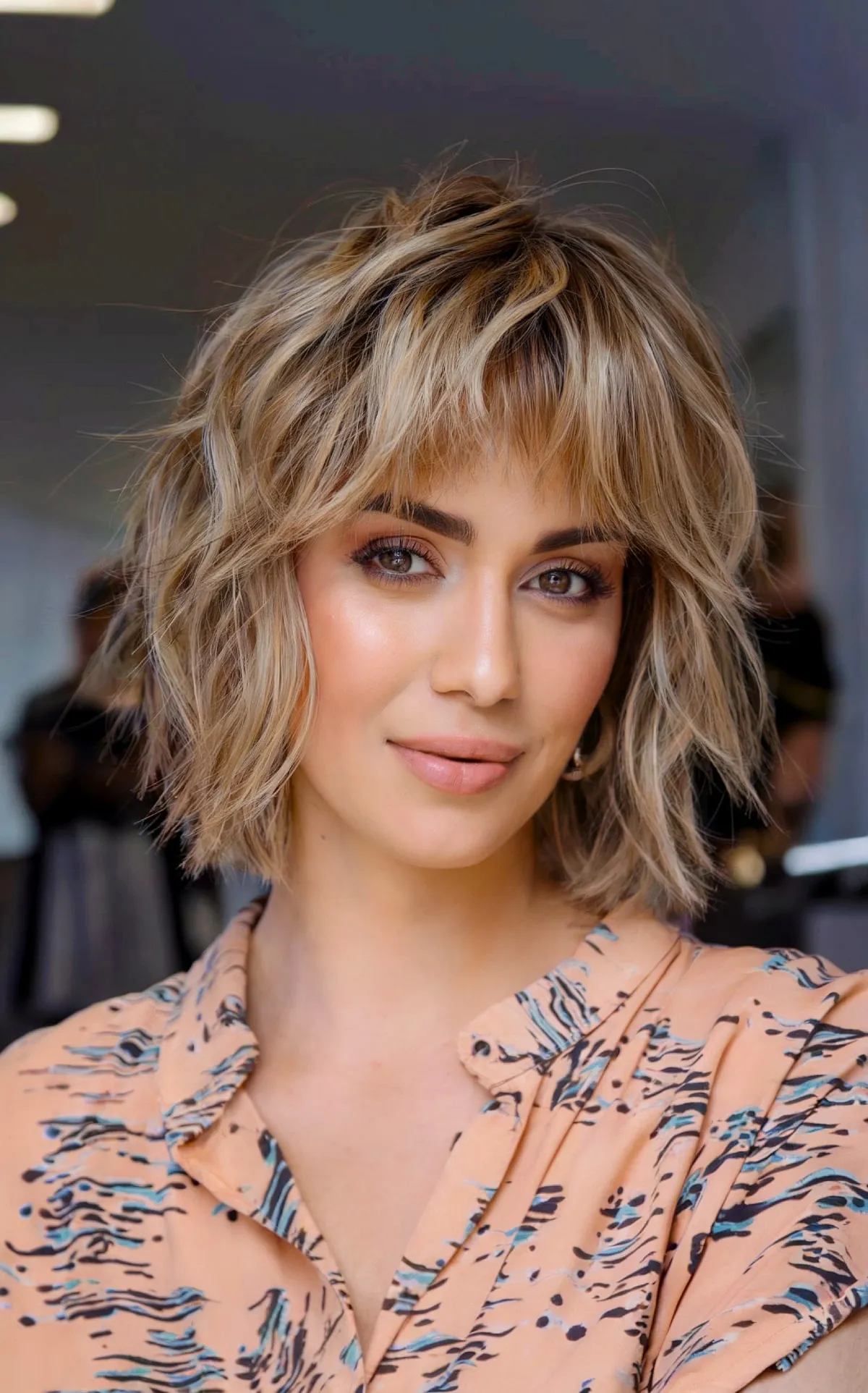 Shaggy Bob featuring Bangs and Effortless Curls for Thin Hair