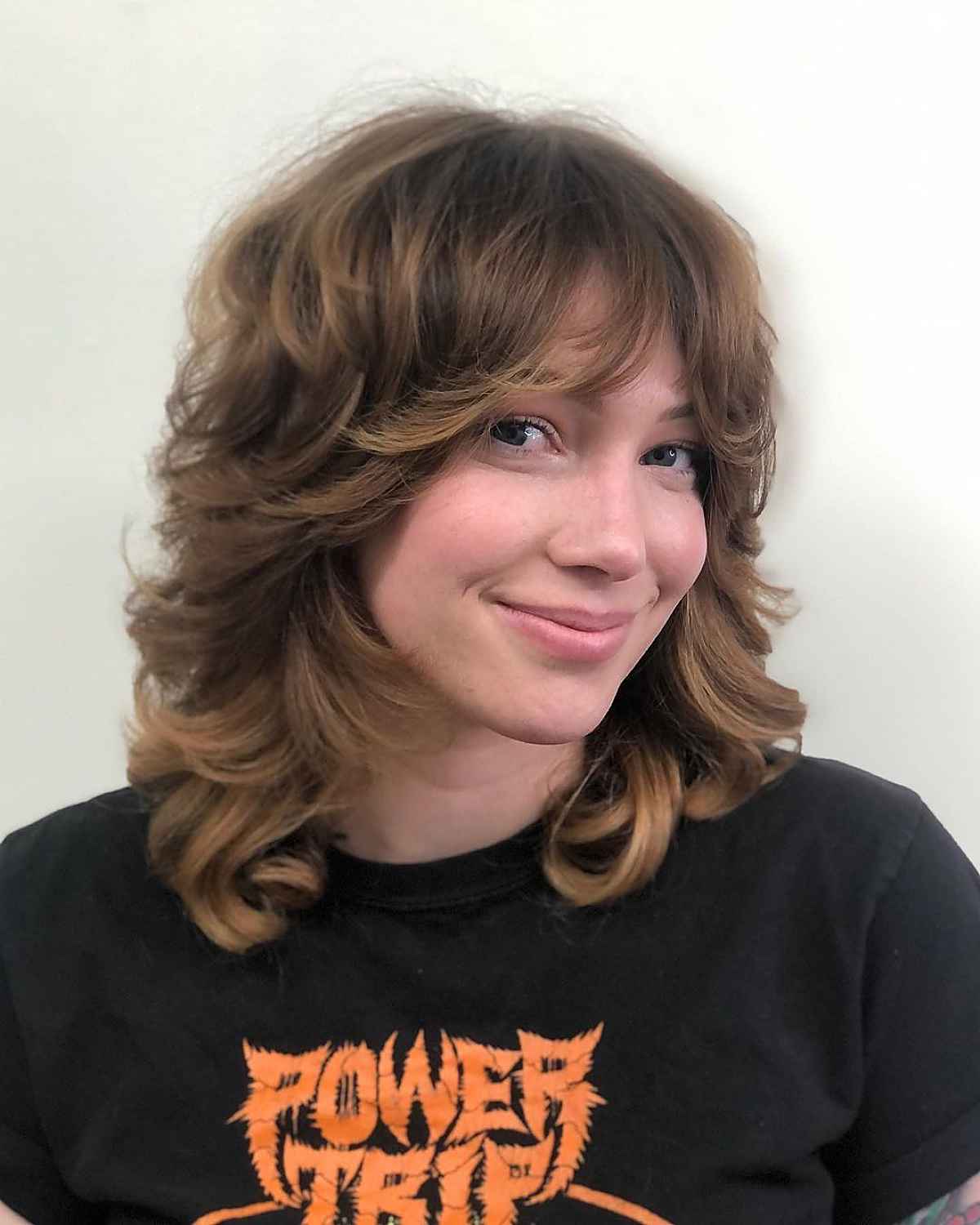 Shag Hairstyle with Shorter Layers and Curtain Bangs