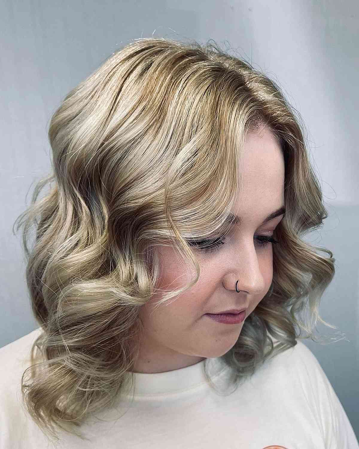 Shimmering Platinum Highlights on Dirty Blonde Omber Hair