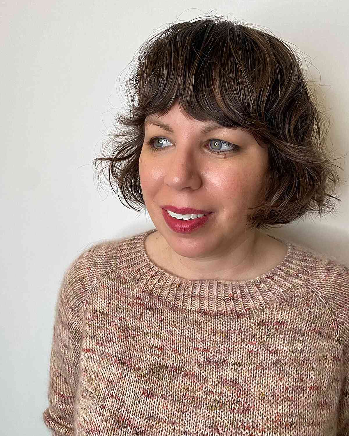 Short French Bob Cut with Bold Bangs