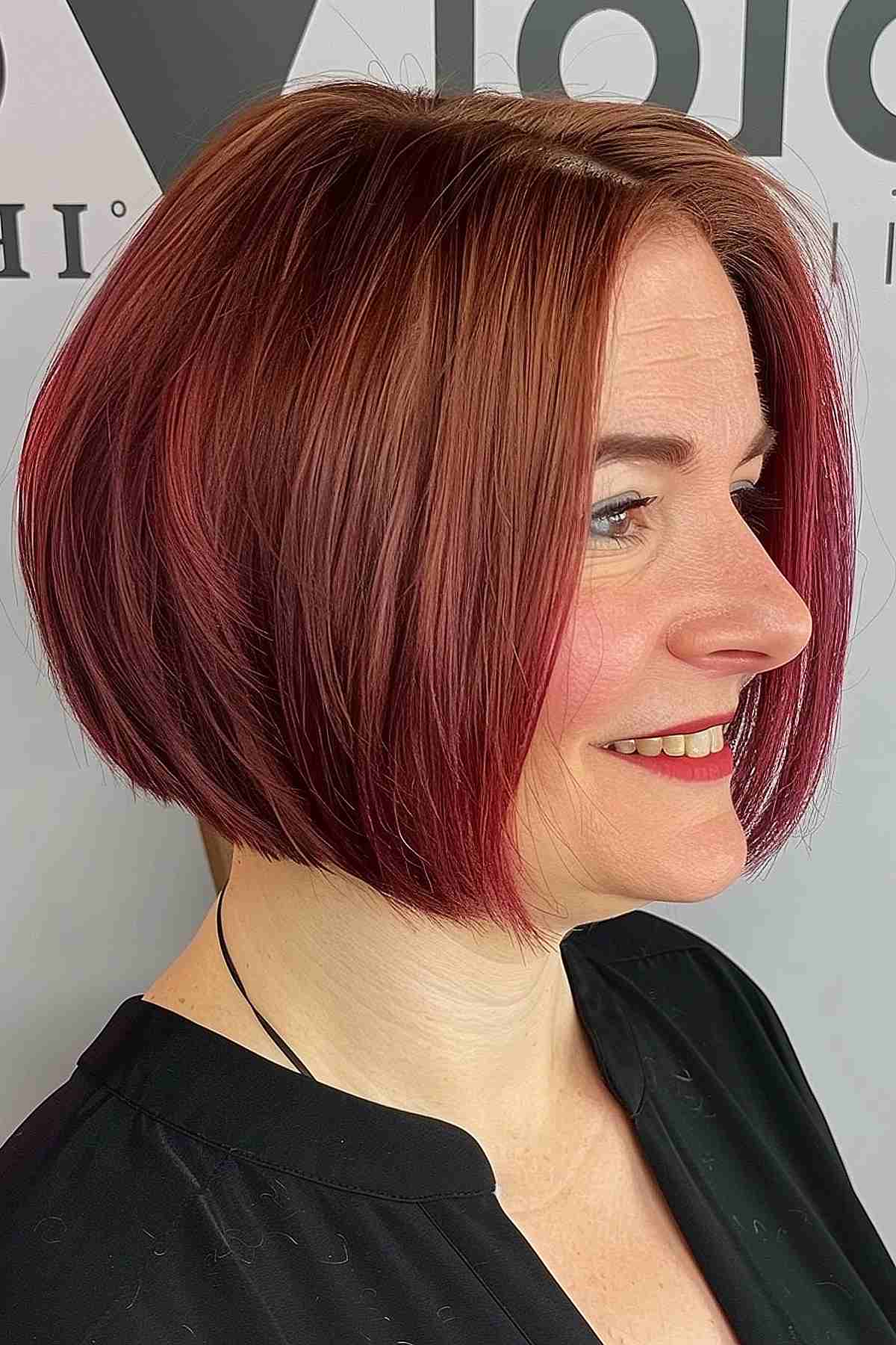 Short haircut featuring blonde and burgundy fusion