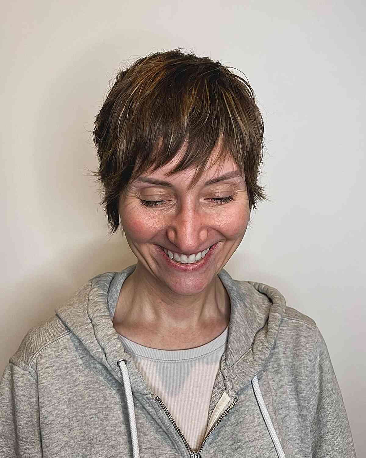 Chic Short Pixie Shag with Side-Swept Bangs for Mature Women