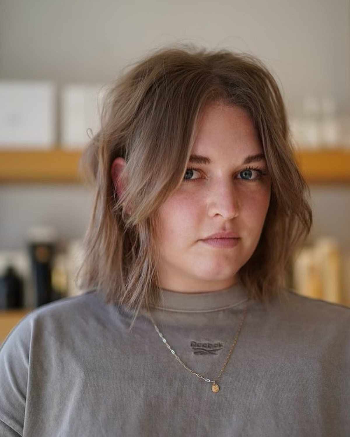 Shoulder-Length Short Textured Bob with Curtain Bangs for Fine Hair