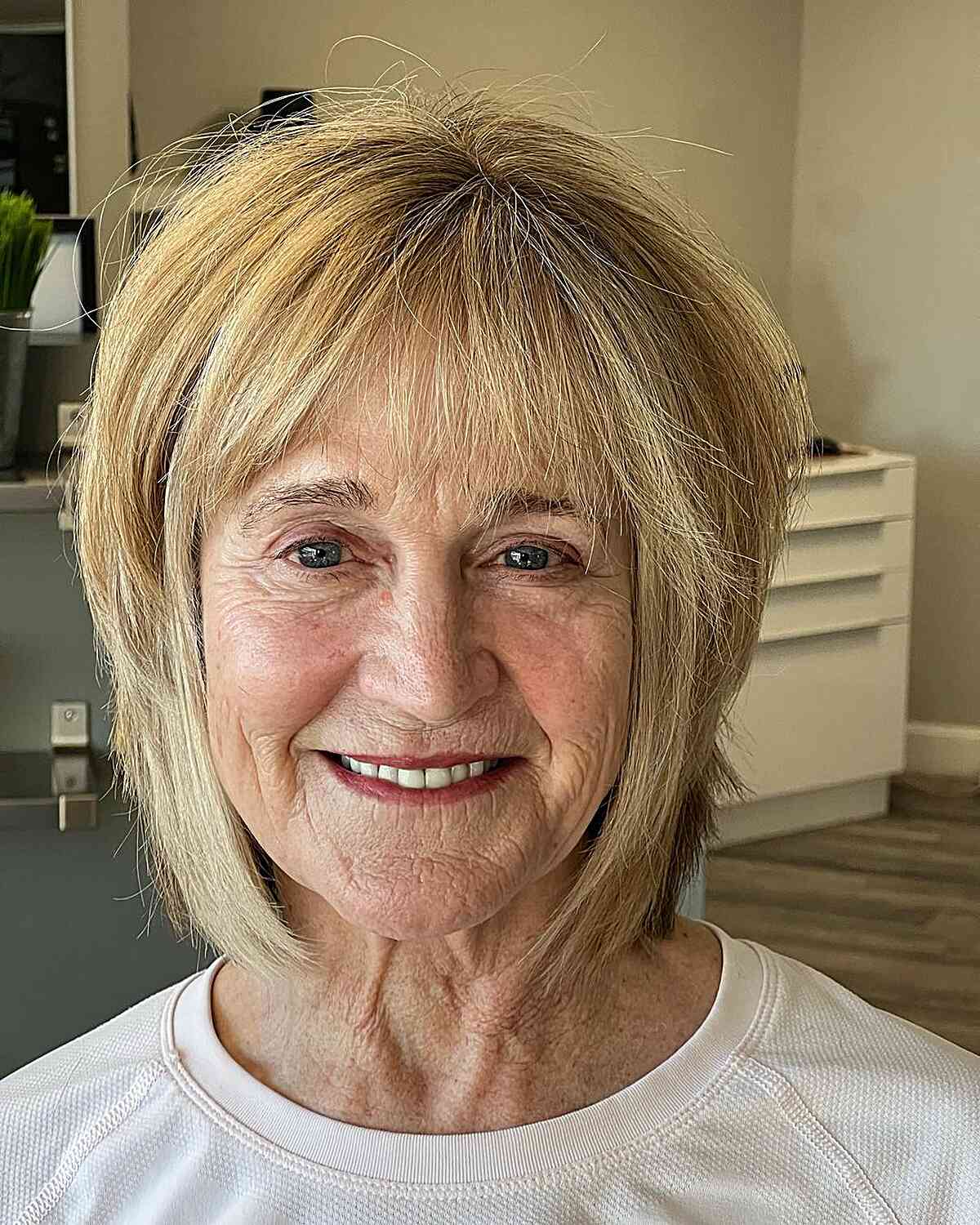Shoulder-Length Choppy Blonde Shaggy Bob for Ladies Over 70