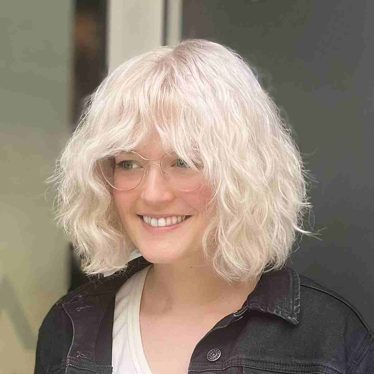 Shoulder-Length Bob Cut with Beachy Waves and Bangs for Dense Hair