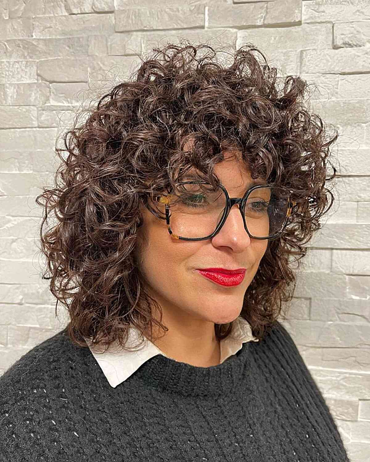 Shoulder-Length Curls for Elongated Faces with Bangs and glasses