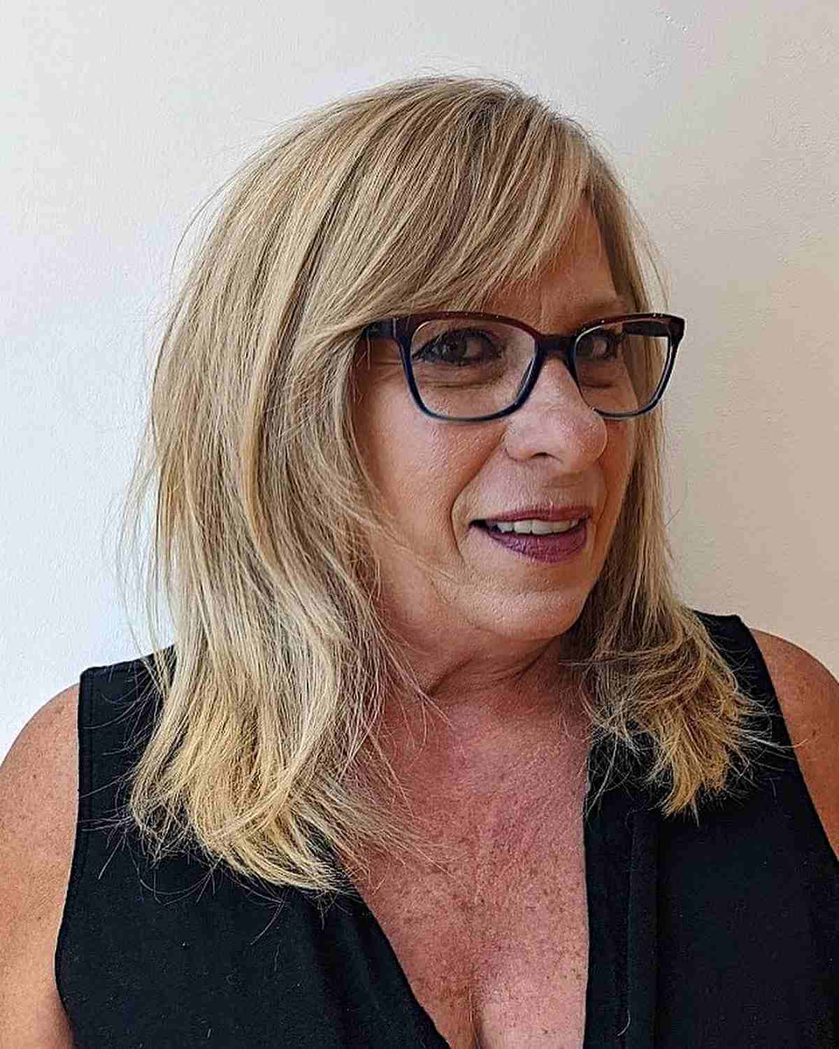 Shoulder-Length Layers and Side Bangs for Women Aged 60 and Above