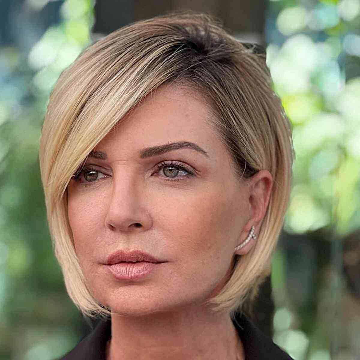 Shoulder-Length Rooted Blonde Bob for Women Over 40 with a deep side part