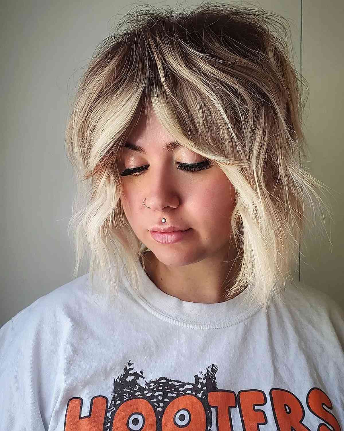 Shoulder-Length Shaggy Wavy Cut with Curtain Bangs for Thick Hair