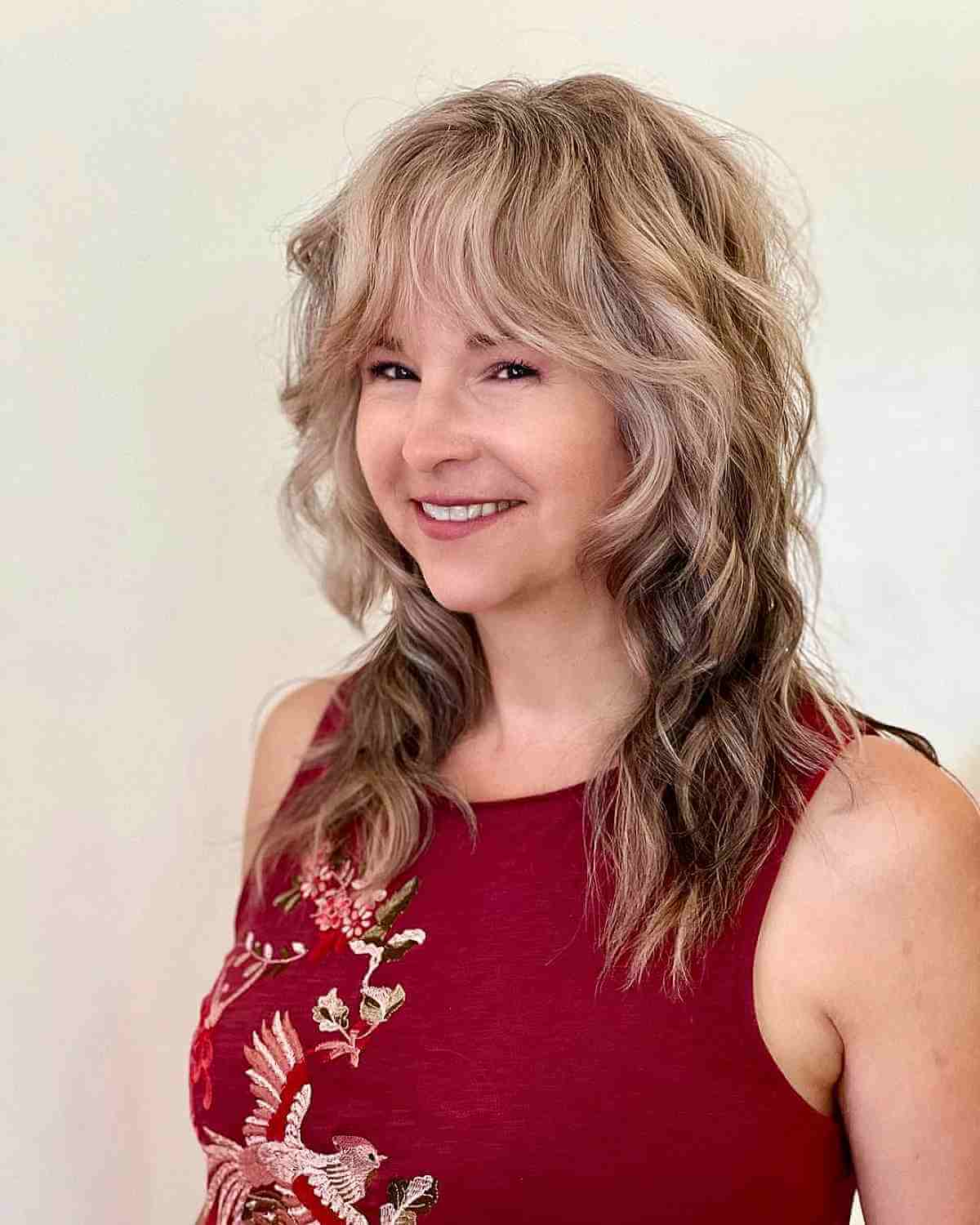 Shullet with Bottleneck Bangs and Soft Waves for a Woman Over 40