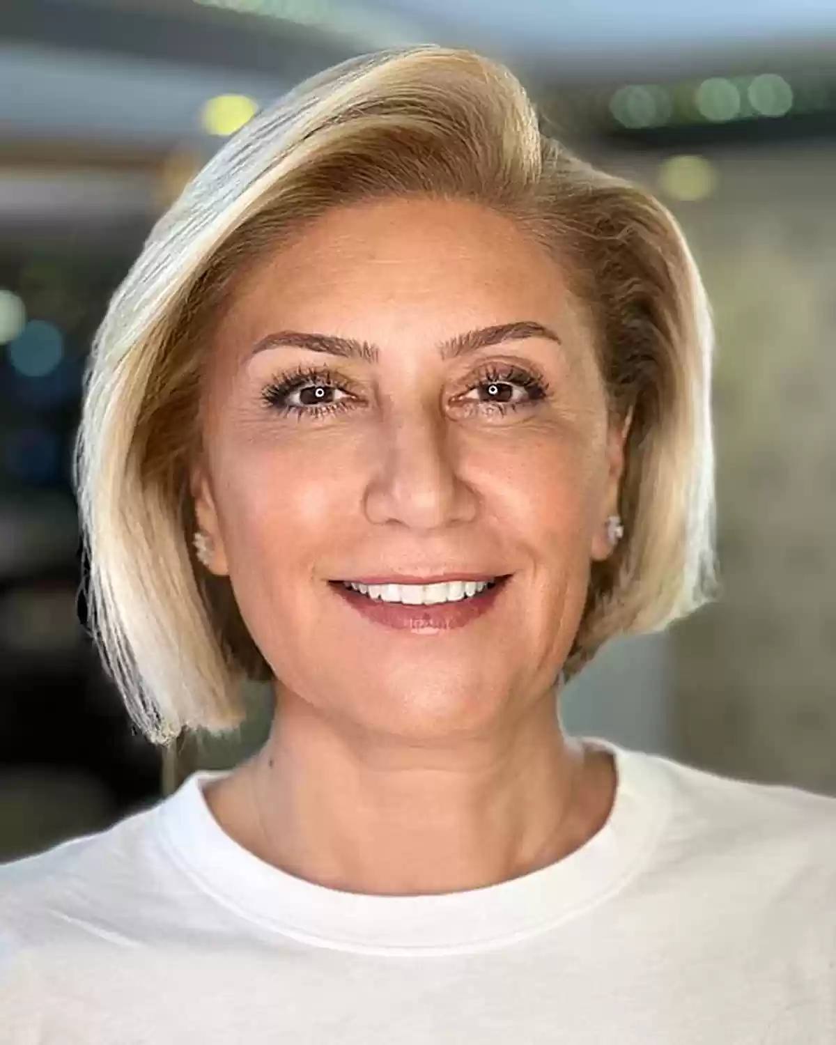 Short Side Parted Asymmetric Blonde Bob for Women Over Fifty