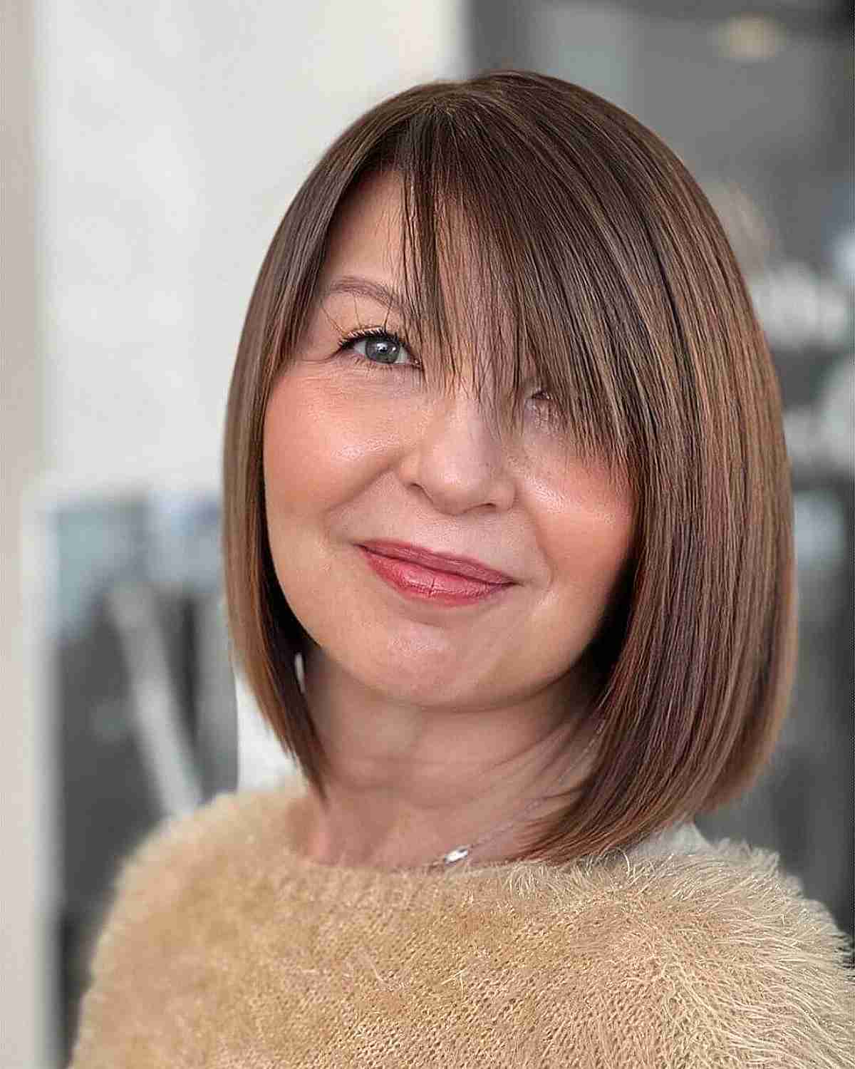 Side-Swept Bangs on a Stylish Bob Cut for 50-Year-Olds with Fine Hair
