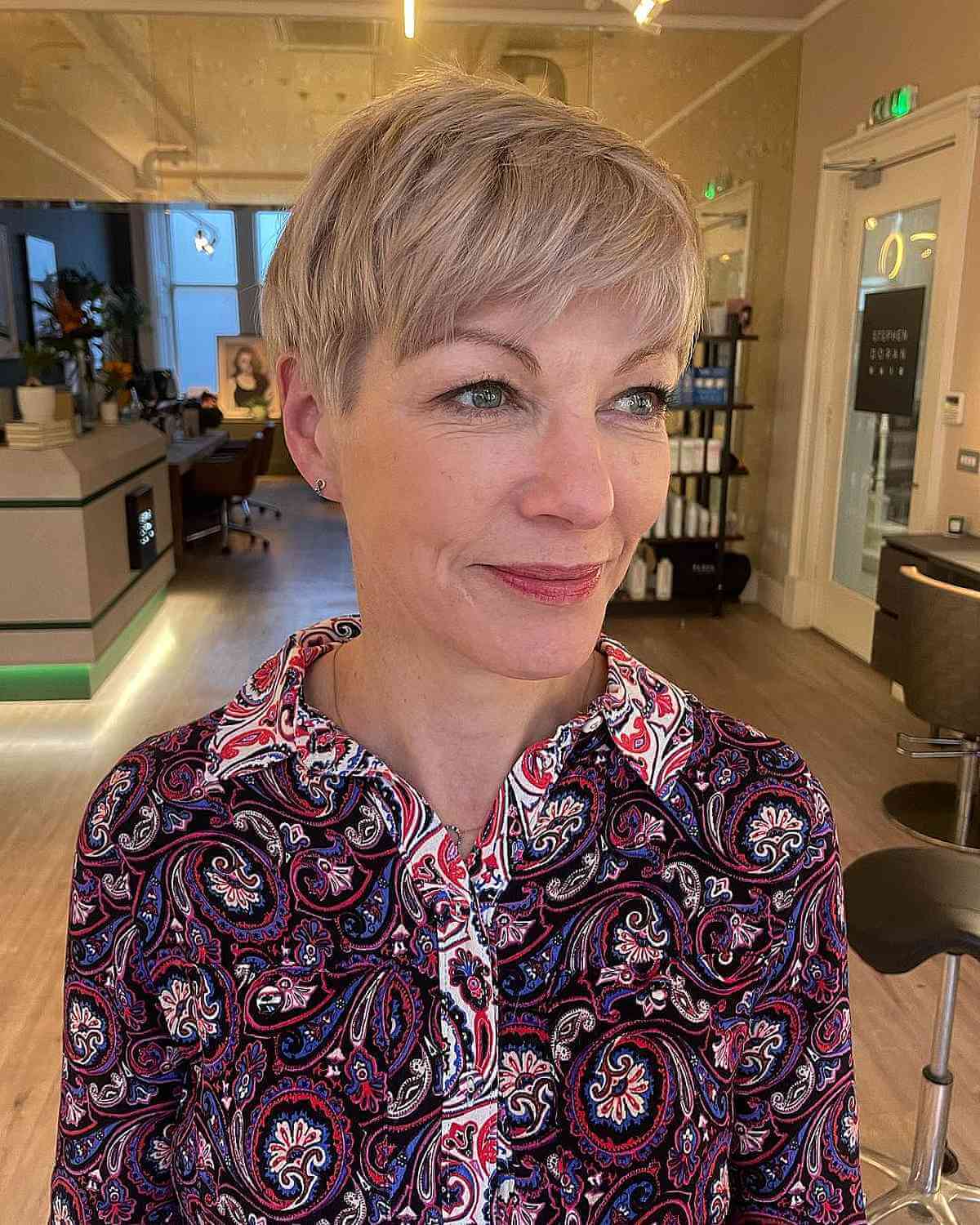 Side-Swept Pixie Cut with Blonde Highlights for Fine Hair