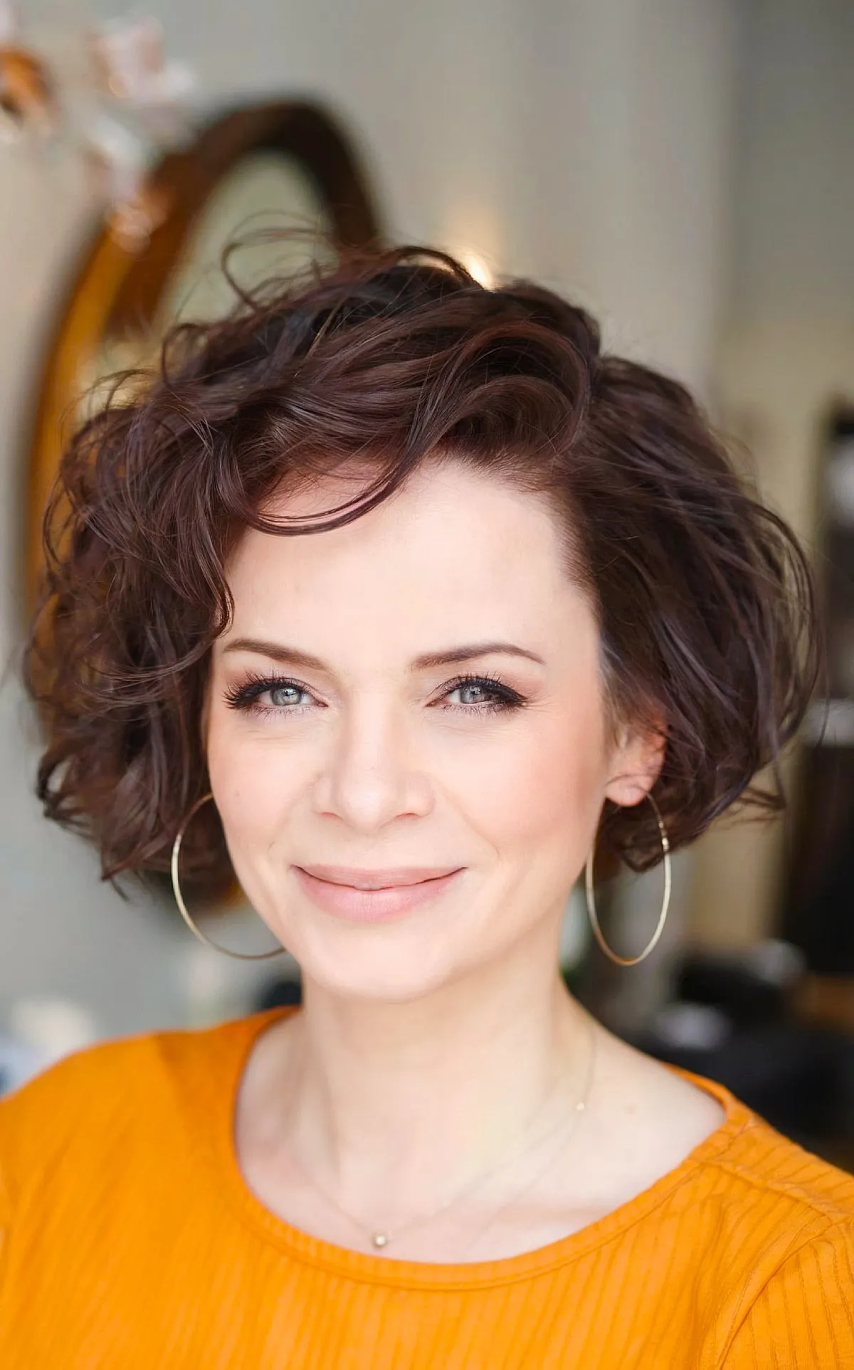 Side-Swept Short Curly Hairstyle for 40-Year-Old Women