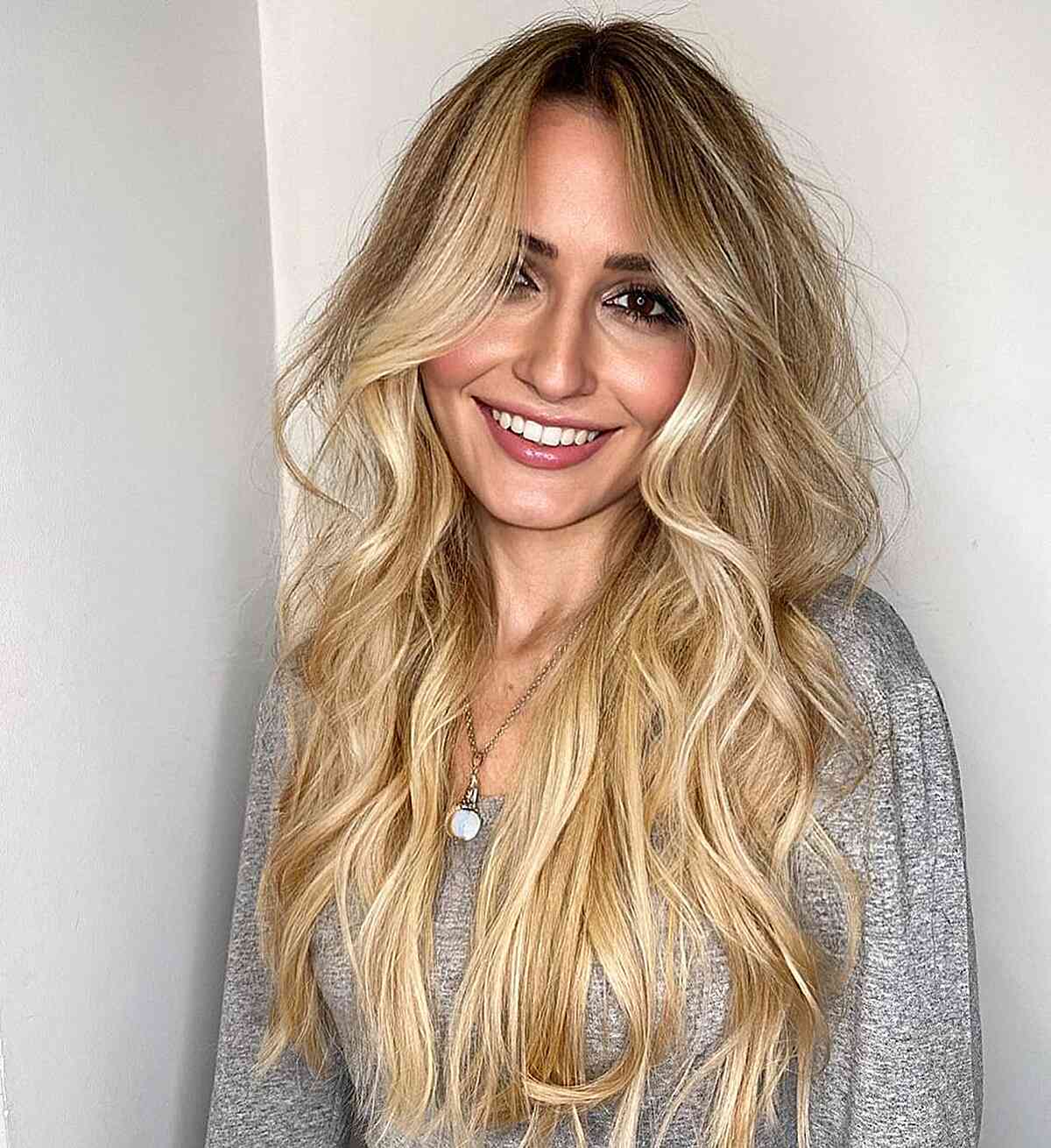 Silky Golden Blonde Balayage with Dark Roots for Long Waves and Face-Framing Hairstyle