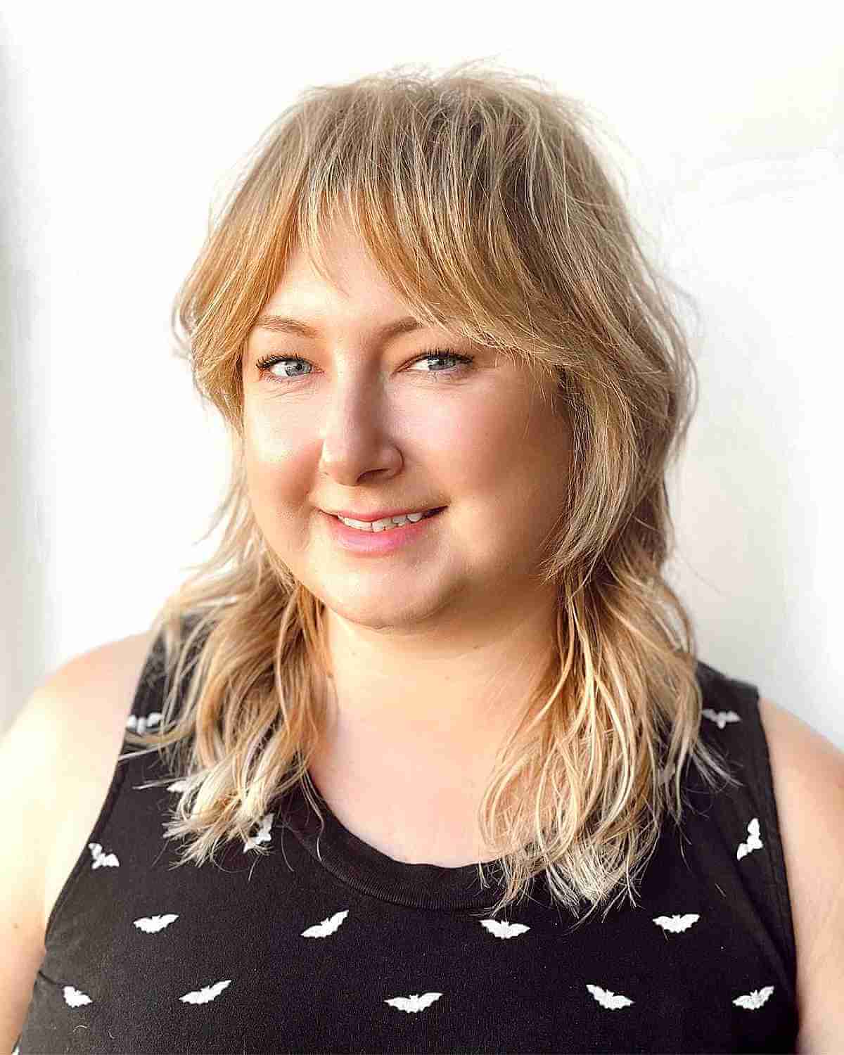 Mid-Length Silky Blonde Razored Shag for Round Faces