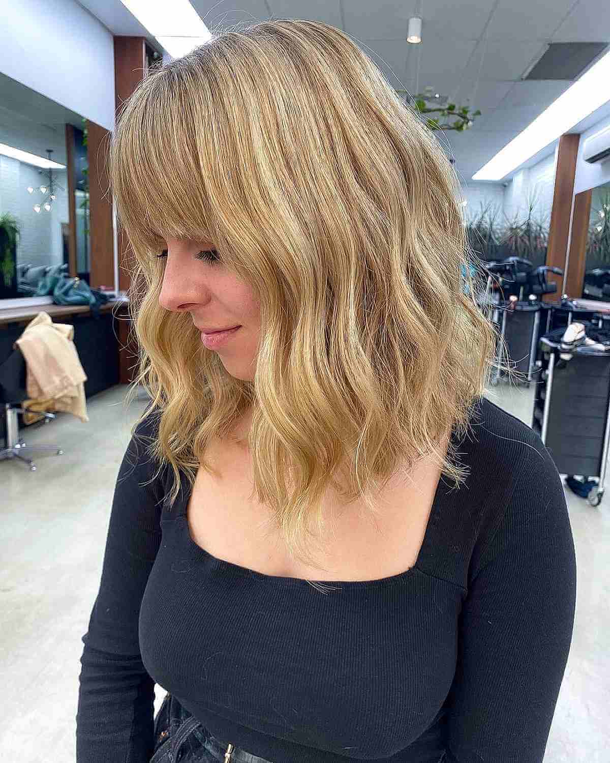 Silky Blonde Wavy Lob with Bangs