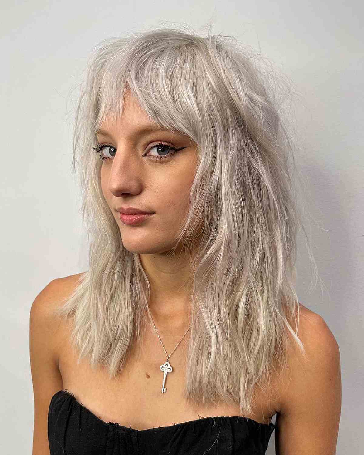 Silver Razor Cut Medium Shag with Bangs