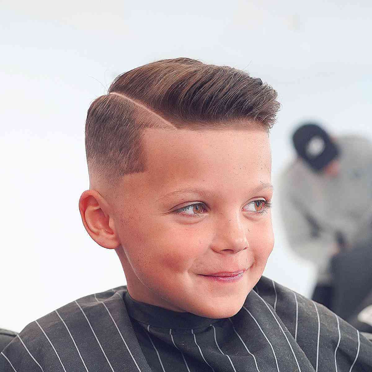 Skin Fade Featuring a Distinct Side Part for Young Boys