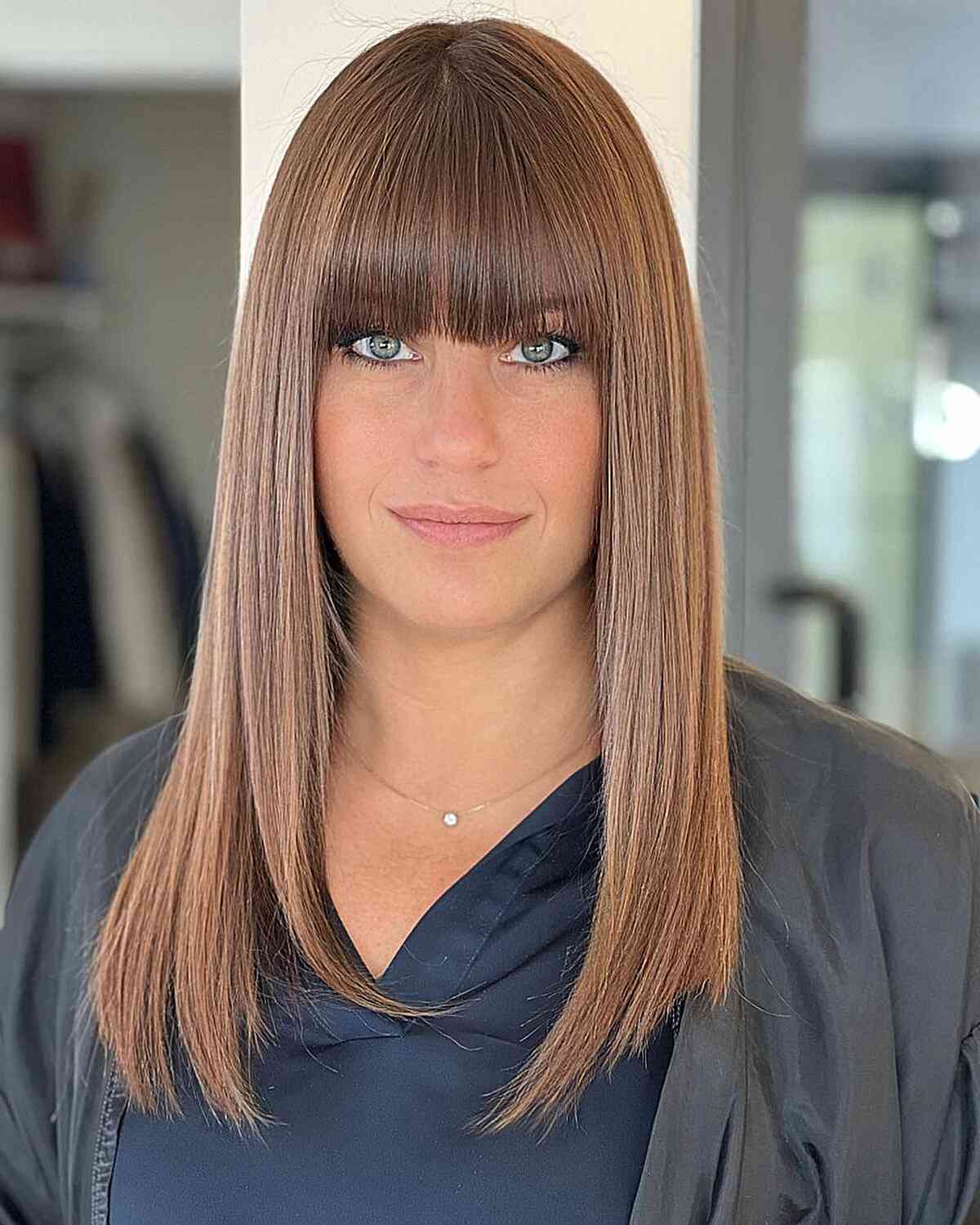 Sleek and Shiny Straight Hair with Bangs for women with blunt long hair