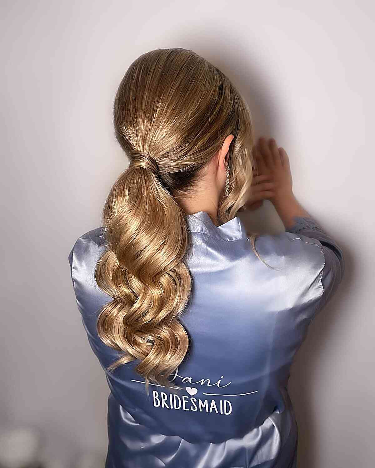 Sleek and Stylish Pony Smooth Blonde Ponytail Back View