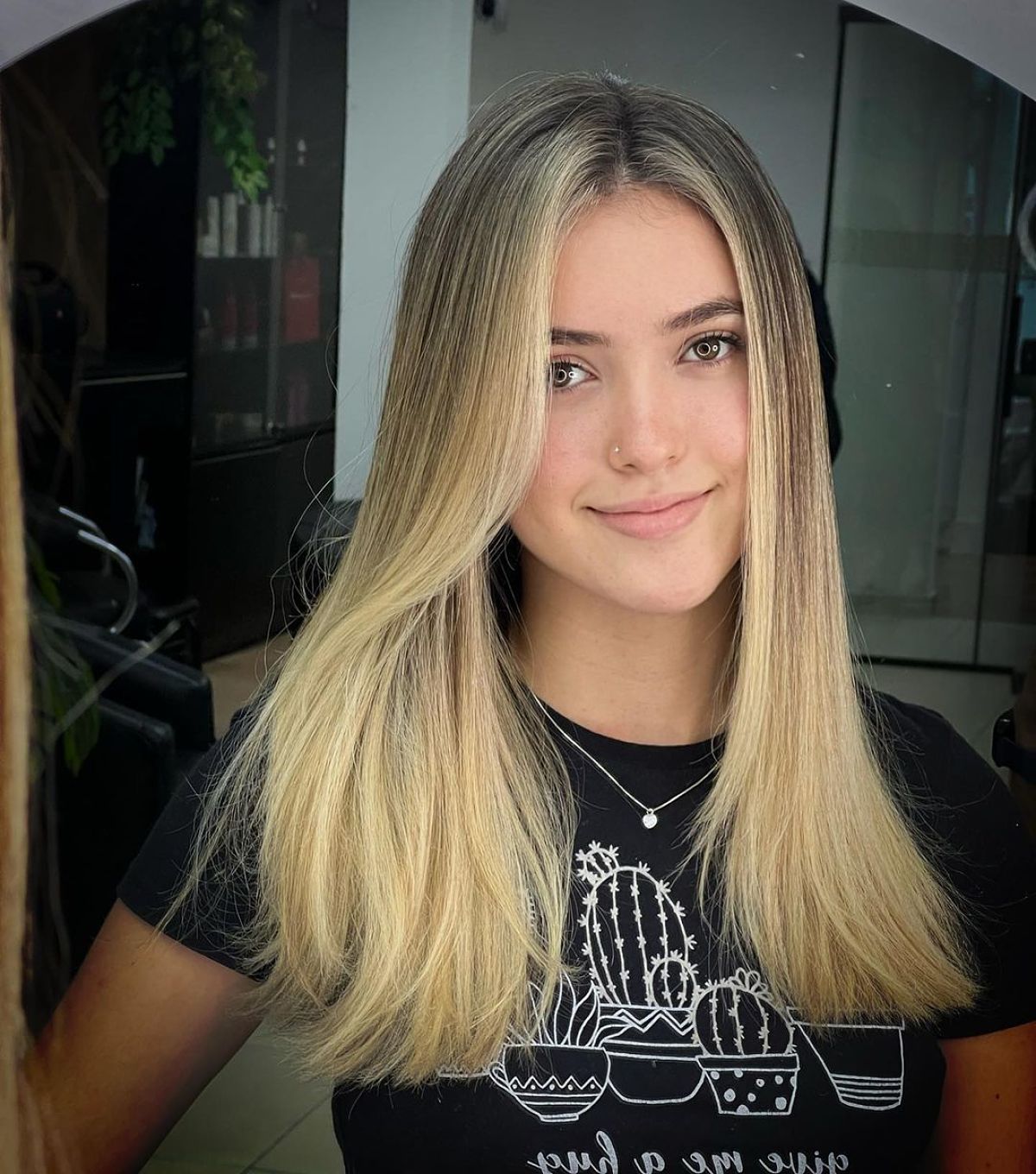 Sleek Blonde Locks with a Center Part