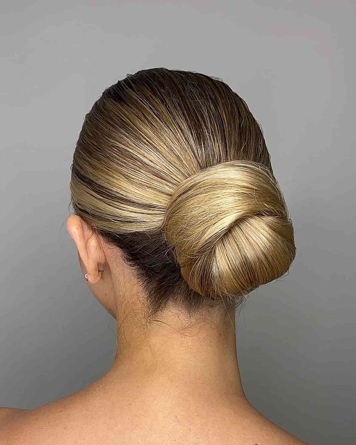 Sleek Blonde Low-Updo Bun for Straighter Locks