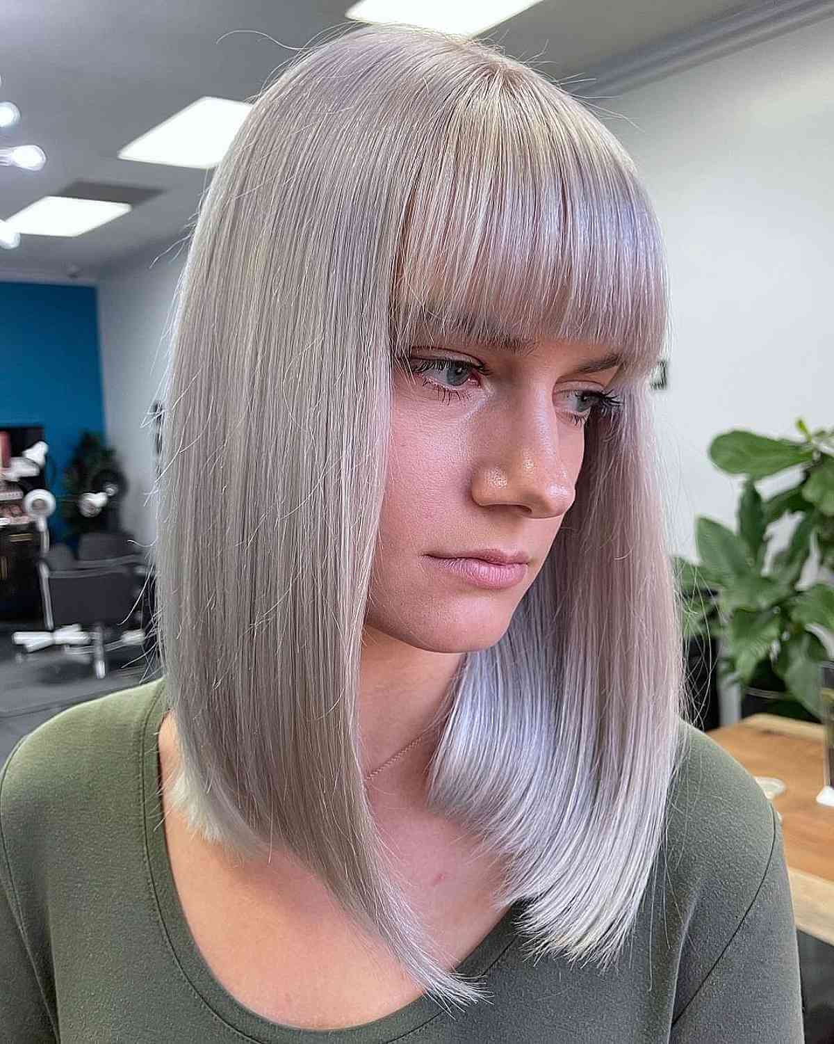 Sleek Blunt Bob with Brow-Length Bangs for Fine Hair