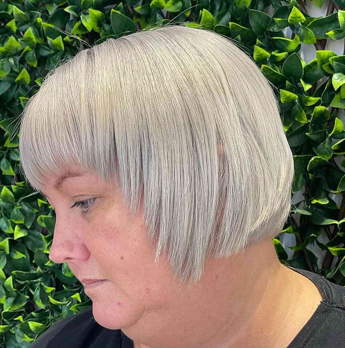 Sleek Bob Haircut with Bangs for Women Over 50