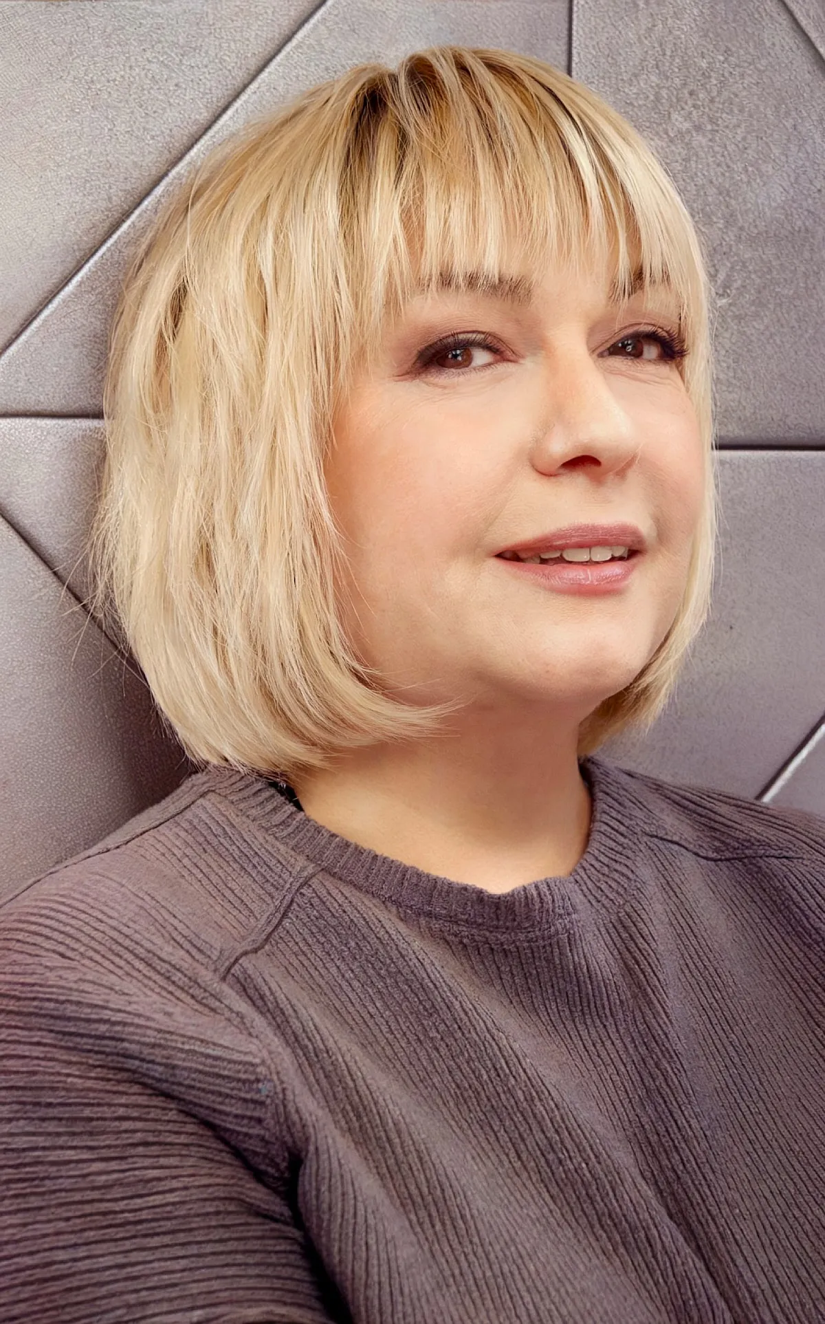 Short-Length Sleek Bob with Textured Ends and Fringes on Older Women with Round Faces