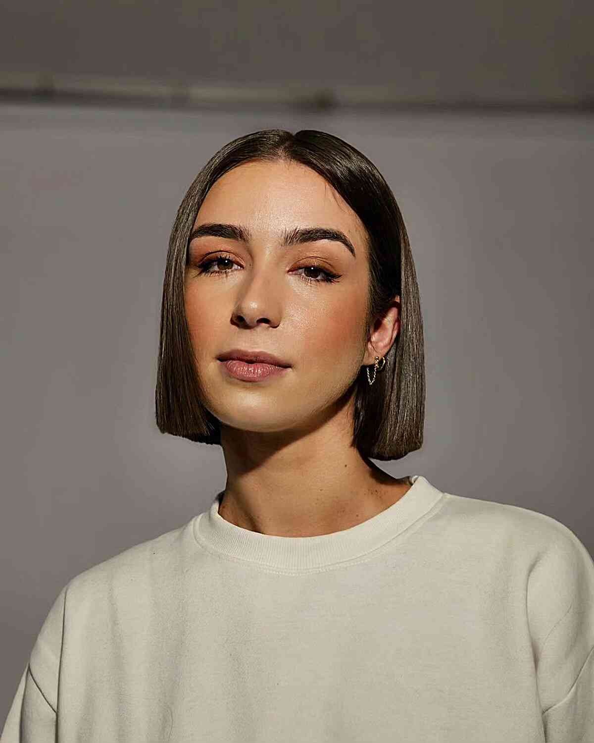Sleek Boyfriend Bob with a Center Part for Neck-Length Hair