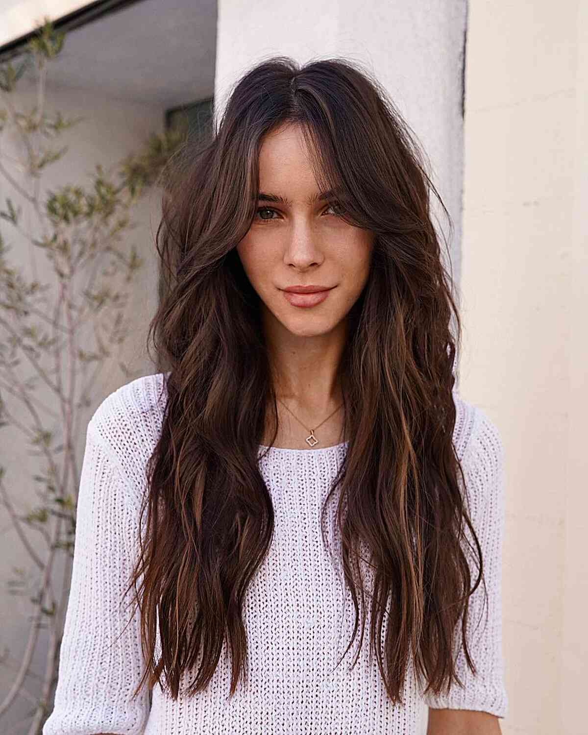 Sleek Choppy Brunette Hairstyle with Hidden Layers