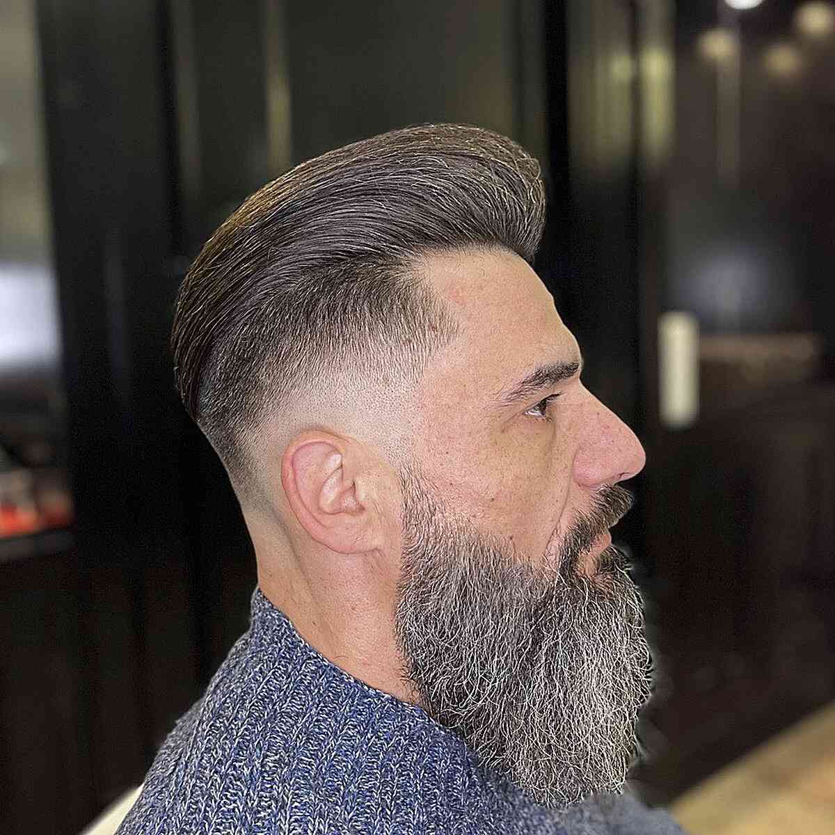Sleek Brushed-Back Pomp with a Skin Fade and Long Beard